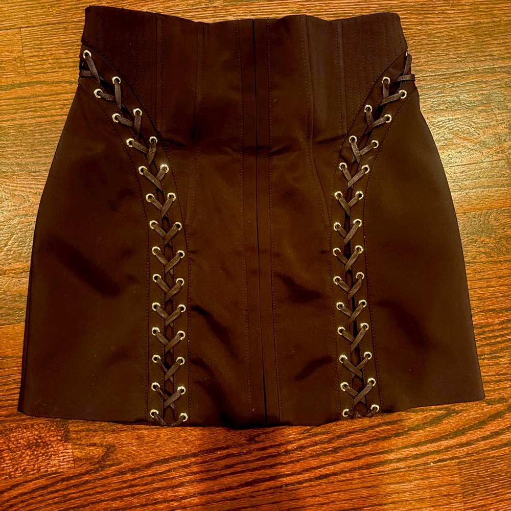 Black structured corset style skirt by British designer Karen Mullen